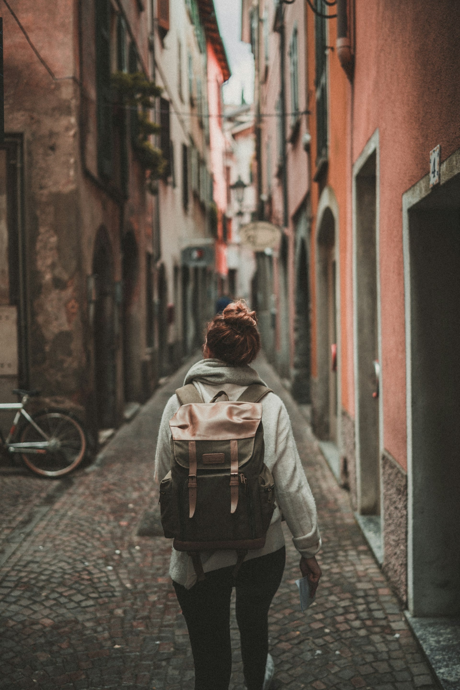 Confident woman walking in urban environment - Solo female travel safety